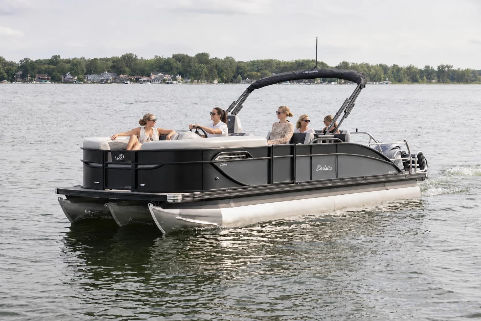 Graphite and black Barletta Cabrio pontoon cruising on the water