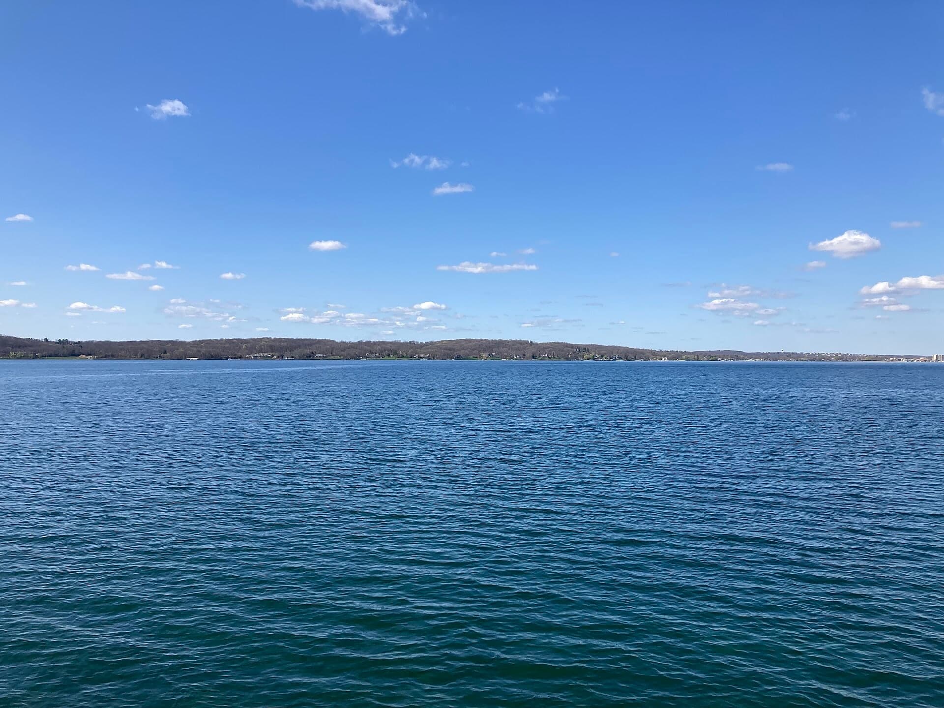 A wide, true-to-life view across Geneva Lake from the water